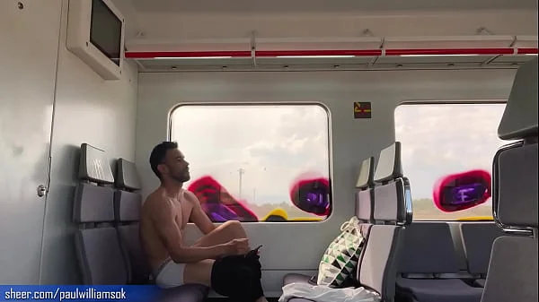 Sexy tanned man travelling naked by train. Very risky public nudity