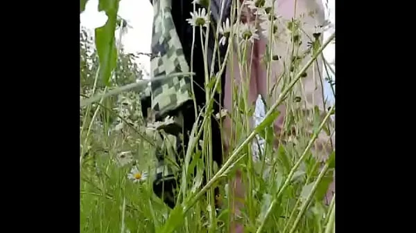 Naked horny MILF in a chamomile field masturbates, pisses and wards off a wasp / Angela-MILF